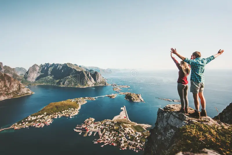 happy-couple-love-travel-raised-hands-cliff-happy-couple-love-travel-raised-hands-cliff-norway-man-woman-112188598